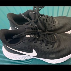 Black and White Nike Revolution Running shoes (Womens 8.5 W) Used